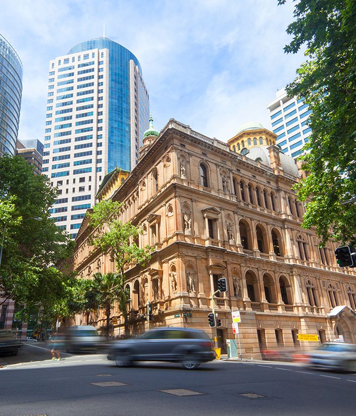 Historic sandstone building among modern office towers in Sydney's CBD